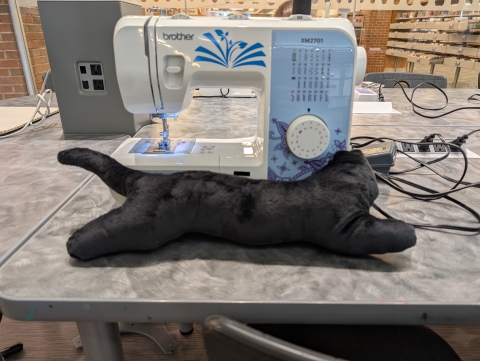black cat plush/pillow and sewing machine