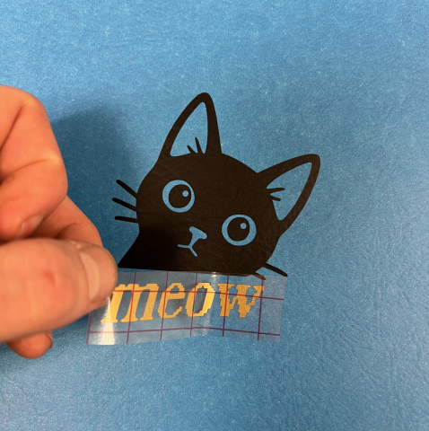 black cat vinyl decal with the word "meow" below it