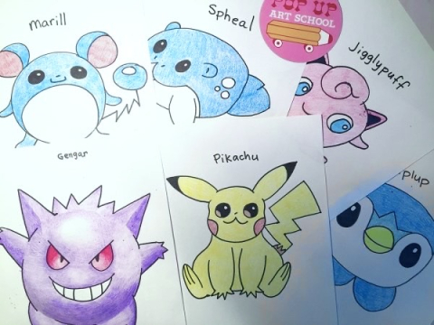 Scattering of white papers, each with a pokemon character drawn on them.