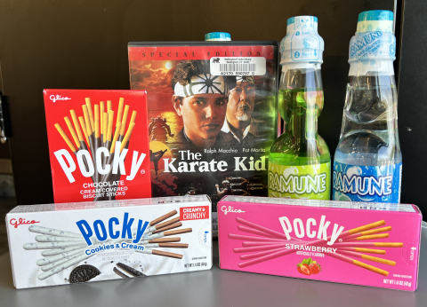 Karate Kid DVD case with ramune drinks and Pocky.