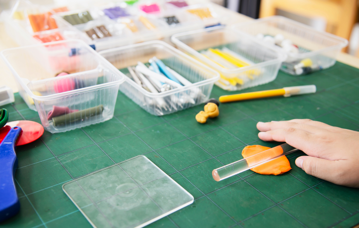 person using polymer clay
