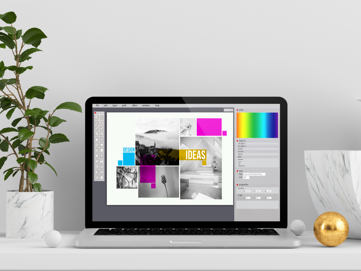 laptop displaying a graphic design program