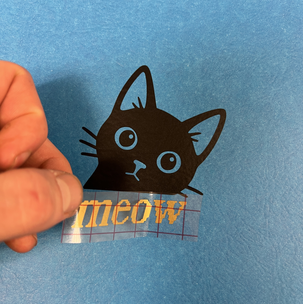 black cat vinyl decal with the word "meow" below it
